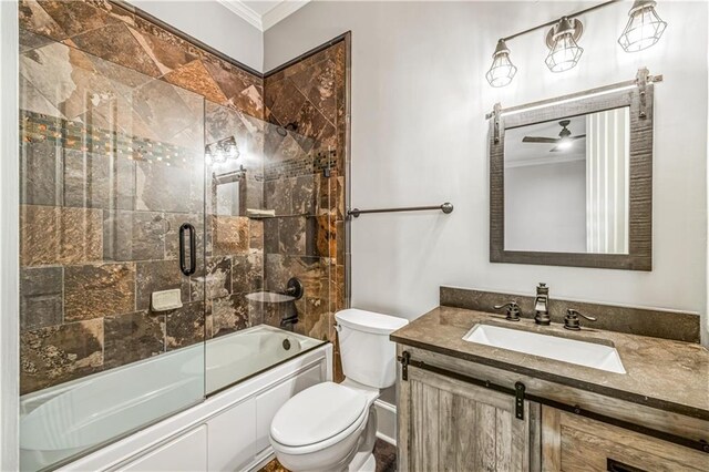 full bathroom with vanity, crown molding, toilet, and shower / bath combination with glass door