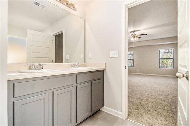 bathroom featuring ceiling fan and vanity