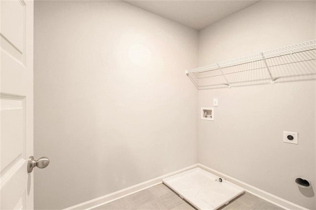 clothes washing area featuring electric dryer hookup and washer hookup