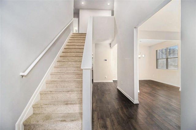 stairs with hardwood / wood-style floors