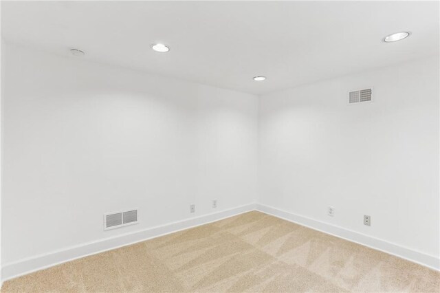 869 Briarcliff Rd NE Unit B25, Atlanta, GA 30306 - empty room featuring light colored carpet, visible vents, baseboards, and recessed lighting