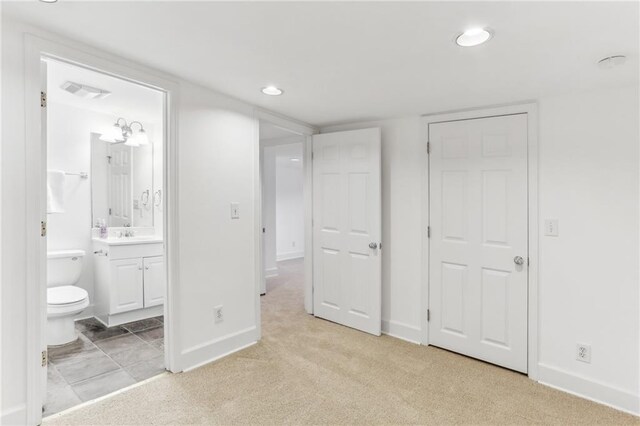 869 Briarcliff Rd NE Unit B25, Atlanta, GA 30306 - unfurnished bedroom featuring recessed lighting, baseboards, and light colored carpet