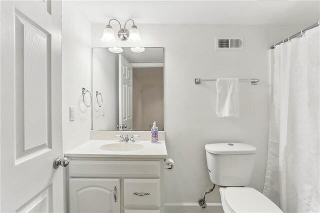 869 Briarcliff Rd NE Unit B25, Atlanta, GA 30306 - full bathroom featuring toilet, visible vents, a chandelier, and vanity