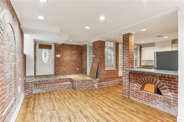 869 Briarcliff Rd NE Unit B25, Atlanta, GA 30306 - interior space featuring light wood-type flooring, brick wall, and recessed lighting