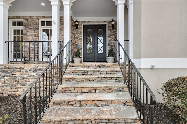 entrance to property with stone siding