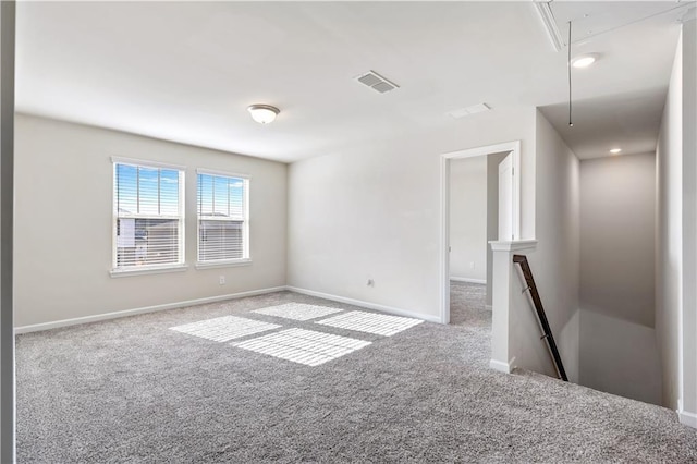 unfurnished room with carpet floors