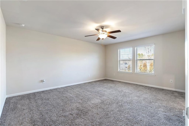 spare room with carpet floors and ceiling fan