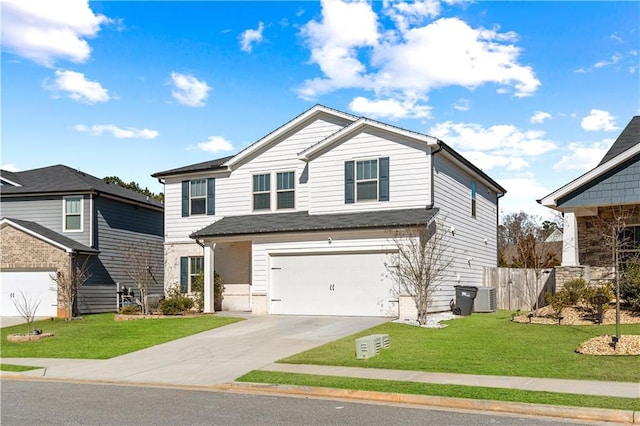 view of front of home with a garage, central AC, and a front lawn