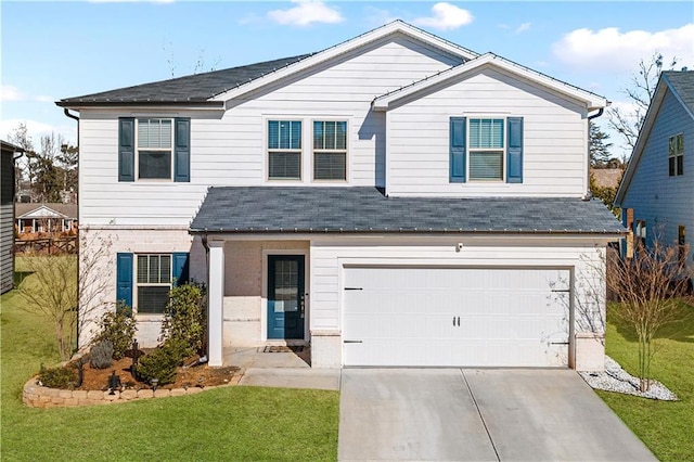 view of front property featuring a garage and a front lawn