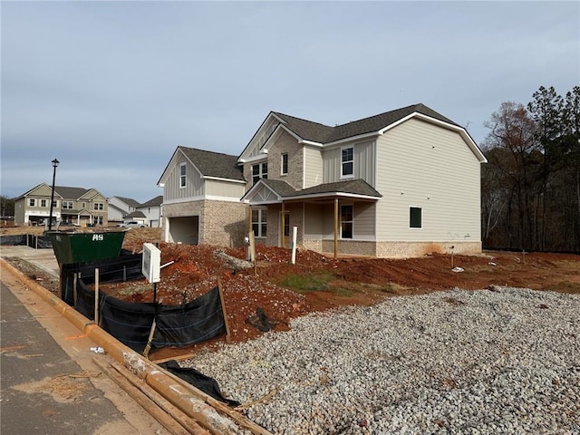 craftsman-style home featuring a front lawn