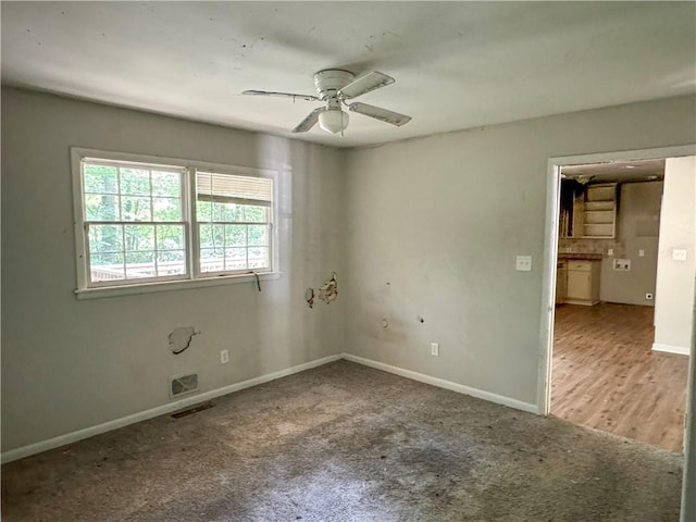 unfurnished room with hardwood / wood-style flooring and ceiling fan