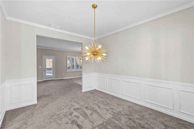 carpeted empty room with crown molding and an inviting chandelier