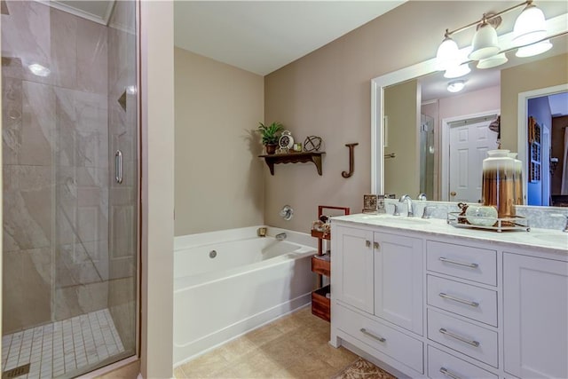 full bathroom with a bath, a sink, double vanity, and a stall shower