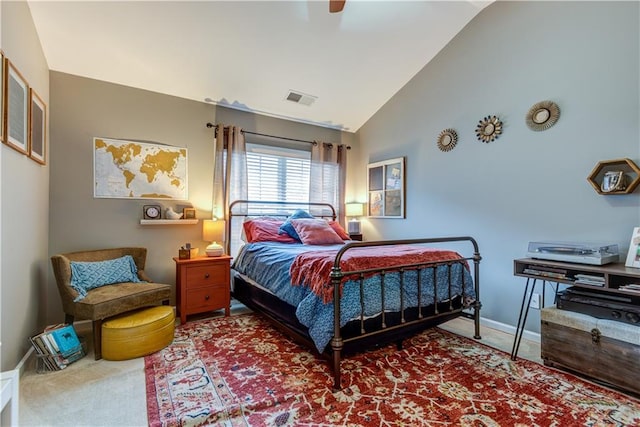 bedroom featuring ceiling fan, vaulted ceiling, and carpet