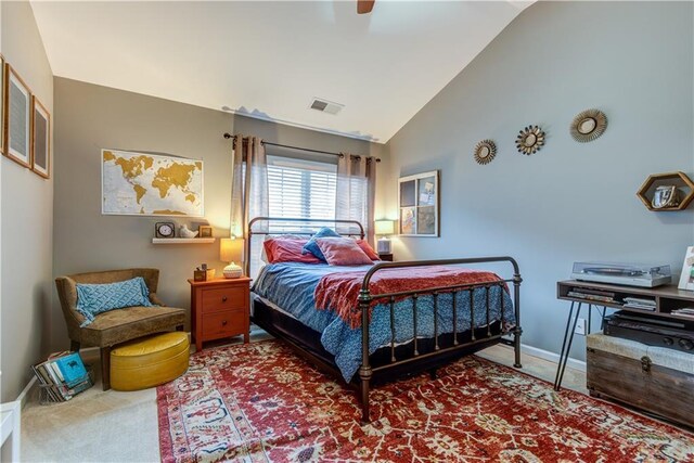 carpeted bedroom featuring baseboards, visible vents, high vaulted ceiling, and ceiling fan