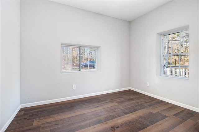 empty room featuring dark hardwood / wood-style floors