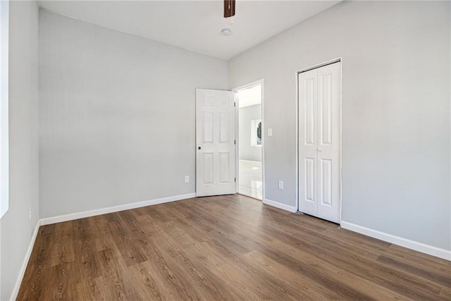 unfurnished room with wood-type flooring and ceiling fan