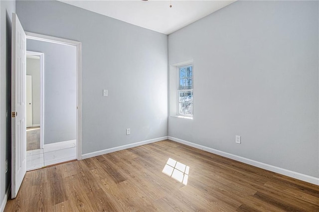 spare room featuring ceiling fan and light hardwood / wood-style floors