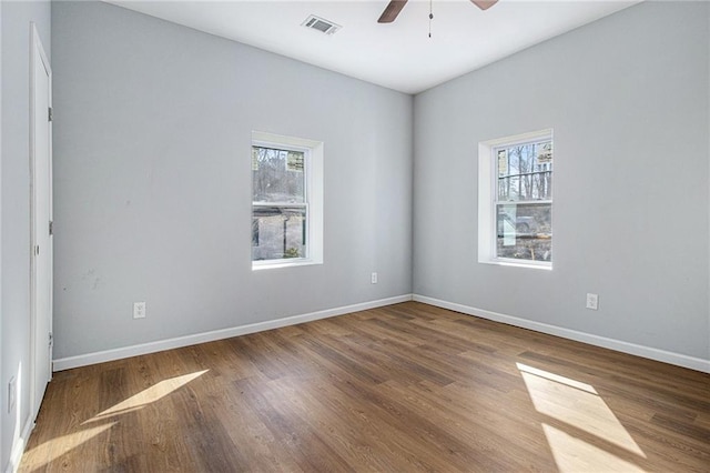 empty room featuring hardwood / wood-style flooring and ceiling fan