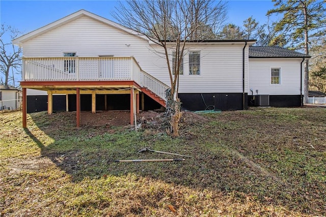 back of property featuring a wooden deck and central AC