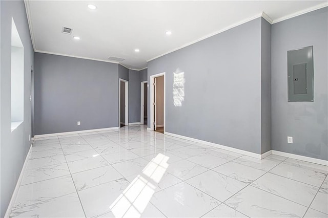 unfurnished room featuring ornamental molding and electric panel