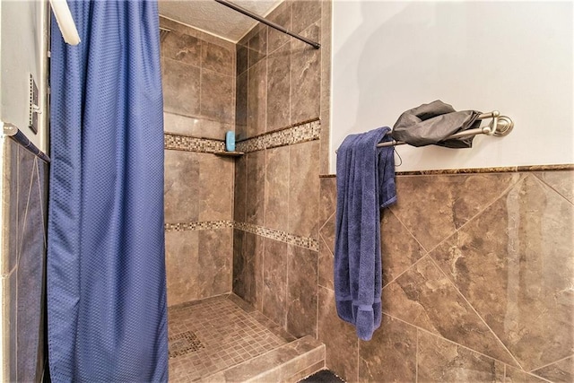 full bath with a shower stall