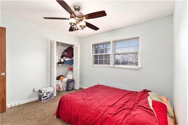 carpeted bedroom featuring a closet, ceiling fan, and baseboards