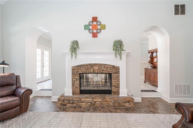 living room with a fireplace and french doors