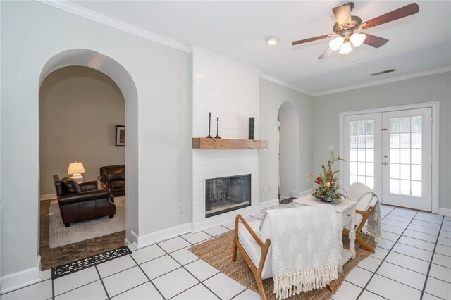 dining room featuring french doors, light tile patterned floors, ceiling fan, and crown molding