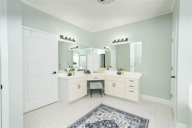 bathroom featuring tile patterned flooring, vanity, and crown molding