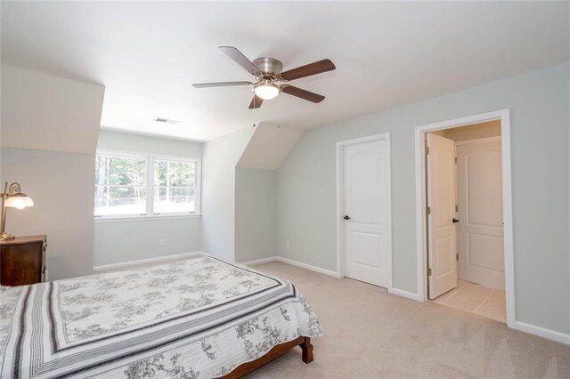 bedroom featuring ceiling fan and light carpet