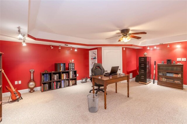 home office featuring carpet floors, track lighting, and ceiling fan