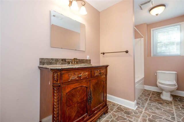 full bathroom featuring vanity,  shower combination, and toilet