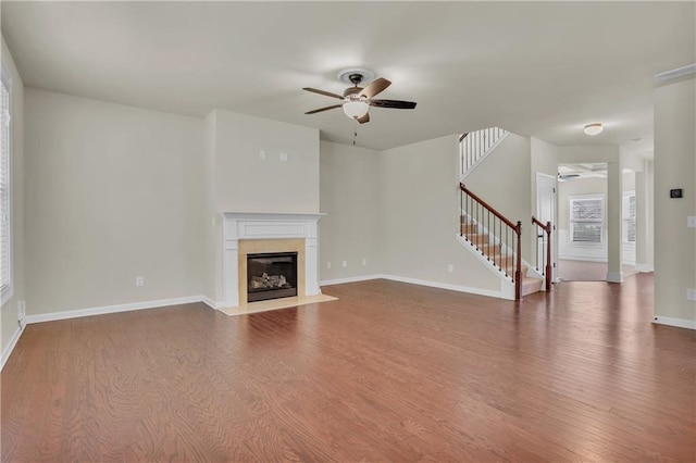 1354 Slate Bend Dr, Dacula, GA 30019 - unfurnished living room featuring wood-type flooring, ceiling fan, and a high end fireplace