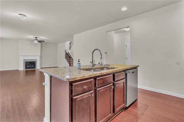 1354 Slate Bend Dr, Dacula, GA 30019 - kitchen with dishwasher, sink, light wood-type flooring, an island with sink, and ceiling fan