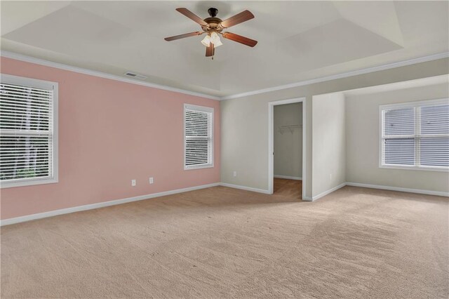 1354 Slate Bend Dr, Dacula, GA 30019 - empty room with ceiling fan, a raised ceiling, crown molding, and light colored carpet