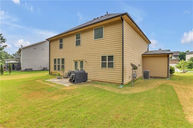 1354 Slate Bend Dr, Dacula, GA 30019 - rear view of property featuring cooling unit, a patio, and a lawn