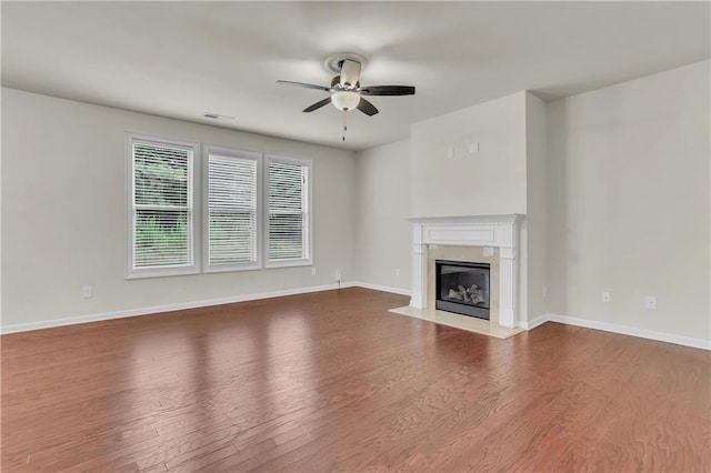 1354 Slate Bend Dr, Dacula, GA 30019 - unfurnished living room with wood-type flooring, ceiling fan, and a premium fireplace