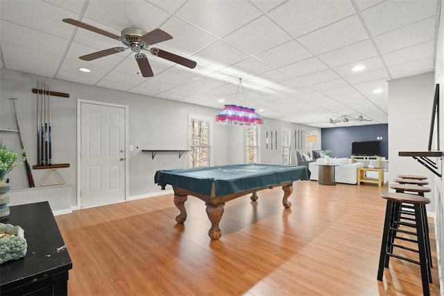 game room with recessed lighting, pool table, wood finished floors, a drop ceiling, and baseboards