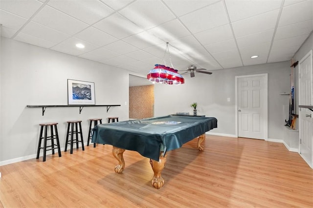 game room with a paneled ceiling, recessed lighting, pool table, light wood-style flooring, and baseboards