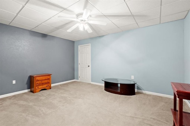 misc room with carpet floors, baseboards, and a ceiling fan