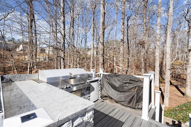 wooden deck with area for grilling