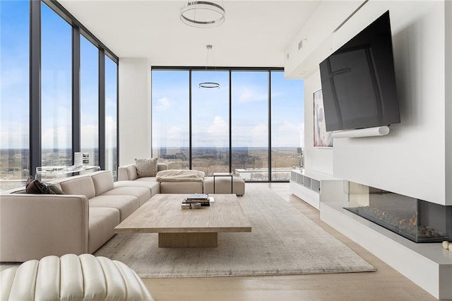 788 W Marietta St Unit 1809, Atlanta, GA 30318 - living room featuring a wall of windows and wood finished floors