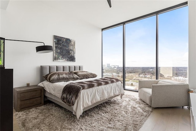 788 W Marietta St Unit 1809, Atlanta, GA 30318 - bedroom with floor to ceiling windows and wood finished floors