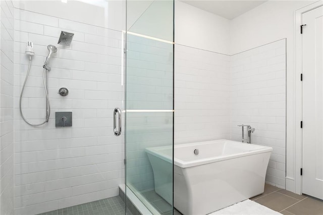 788 W Marietta St Unit 1809, Atlanta, GA 30318 - bathroom with tile patterned flooring, a shower stall, and a soaking tub