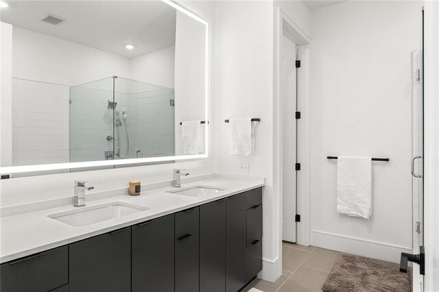 788 W Marietta St Unit 1809, Atlanta, GA 30318 - full bathroom featuring a stall shower, double vanity, tile patterned floors, and recessed lighting