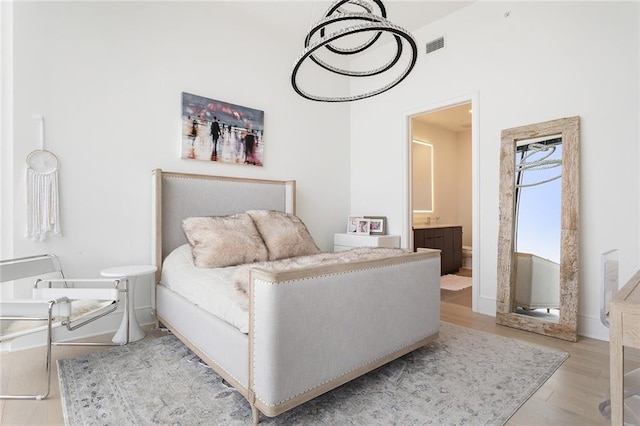 788 W Marietta St Unit 1809, Atlanta, GA 30318 - bedroom featuring wood finished floors and connected bathroom