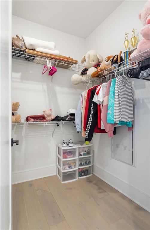 788 W Marietta St Unit 1809, Atlanta, GA 30318 - walk in closet featuring wood finished floors