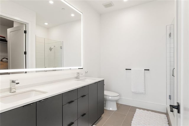 788 W Marietta St Unit 1809, Atlanta, GA 30318 - bathroom with a shower stall, double vanity, toilet, tile patterned floors, and recessed lighting