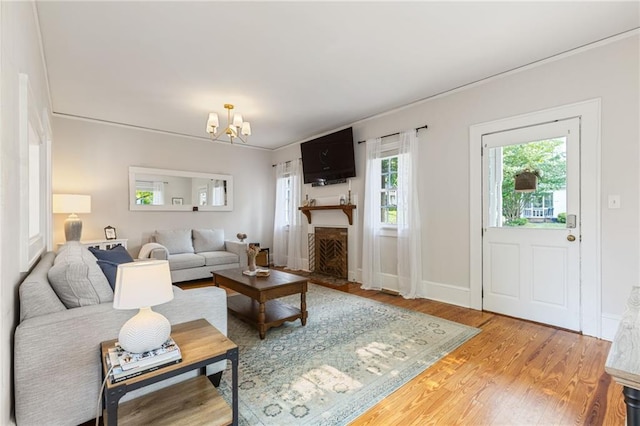 67 Trammell St SW, Marietta, GA 30064 - living room with wood finished floors, a chandelier, and baseboards